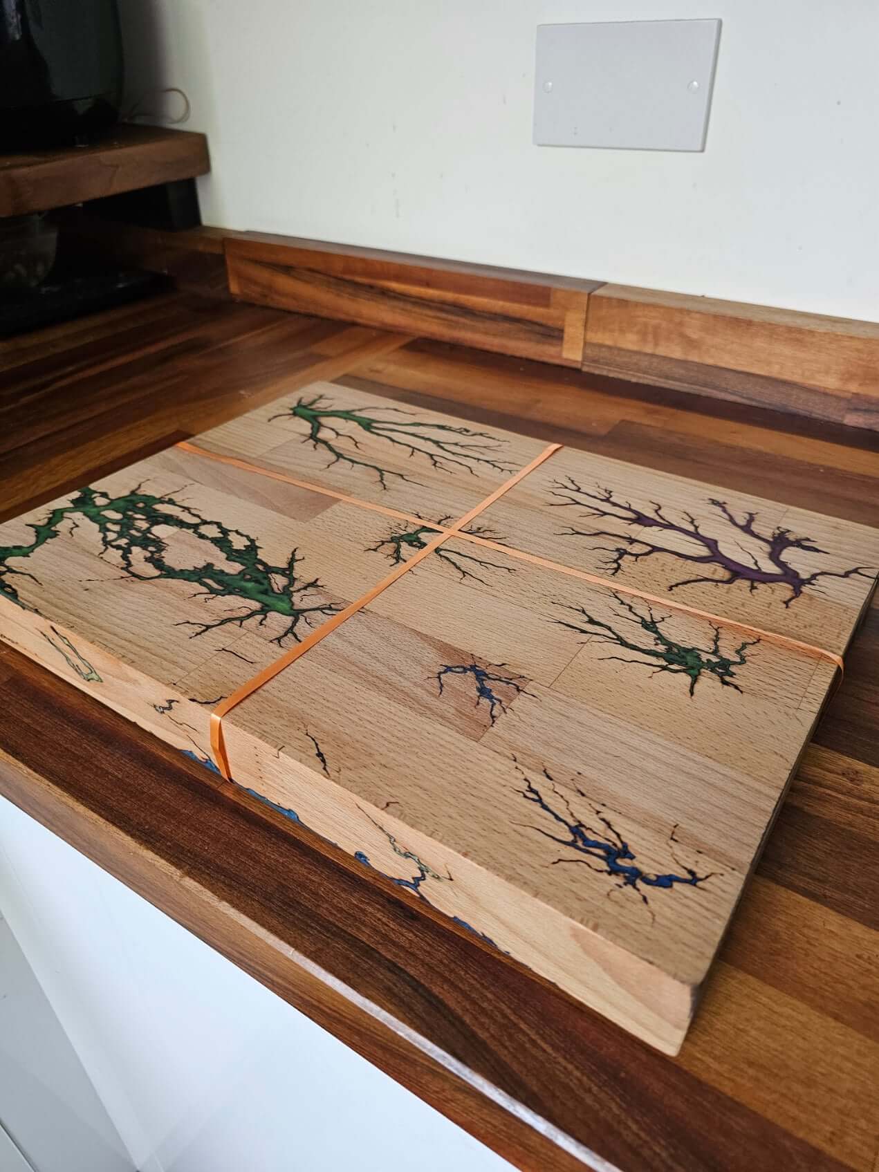Handmade Multi-Colour Fractal Burn Chopping Board with unique lightning-style patterns on a wooden surface.