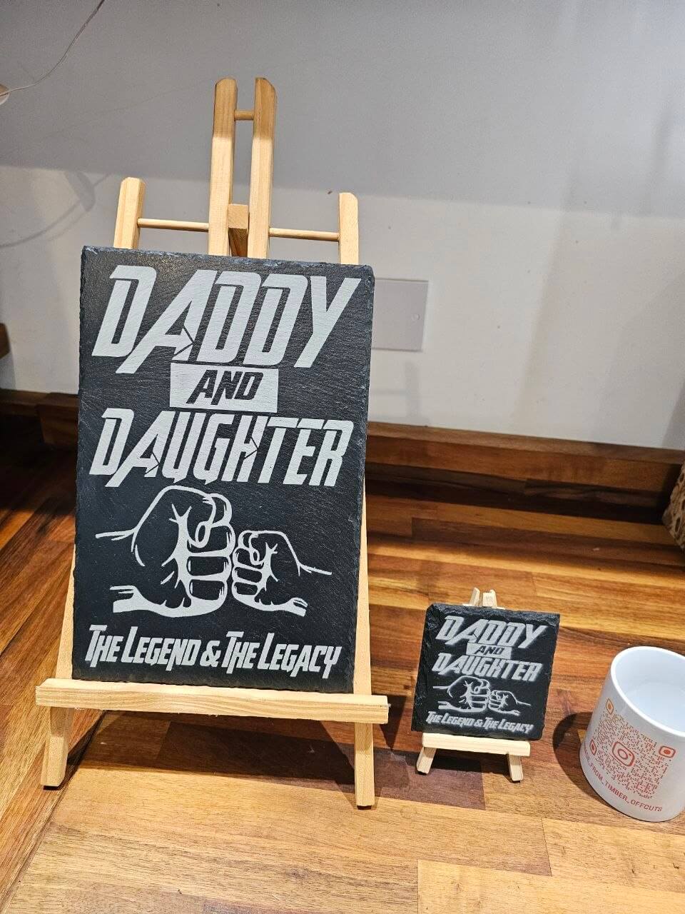 Slate Coasters Daddy & Daughter with engraved design featuring the phrase and fist bump on display