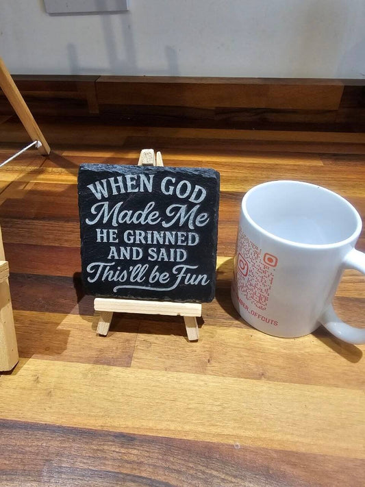 30cm x 20cm Premium Engraved Slate Plaque – “When God Made Me…” displayed on an easel next to a coffee mug.
