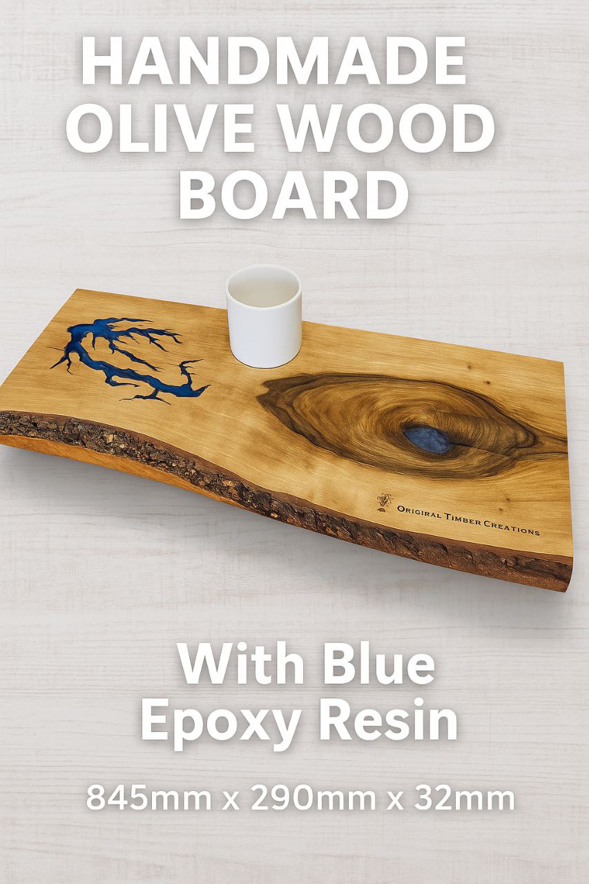 Handmade chopping board made of olive wood with blue epoxy resin detail, dimensions 845mm x 290mm x 32mm.