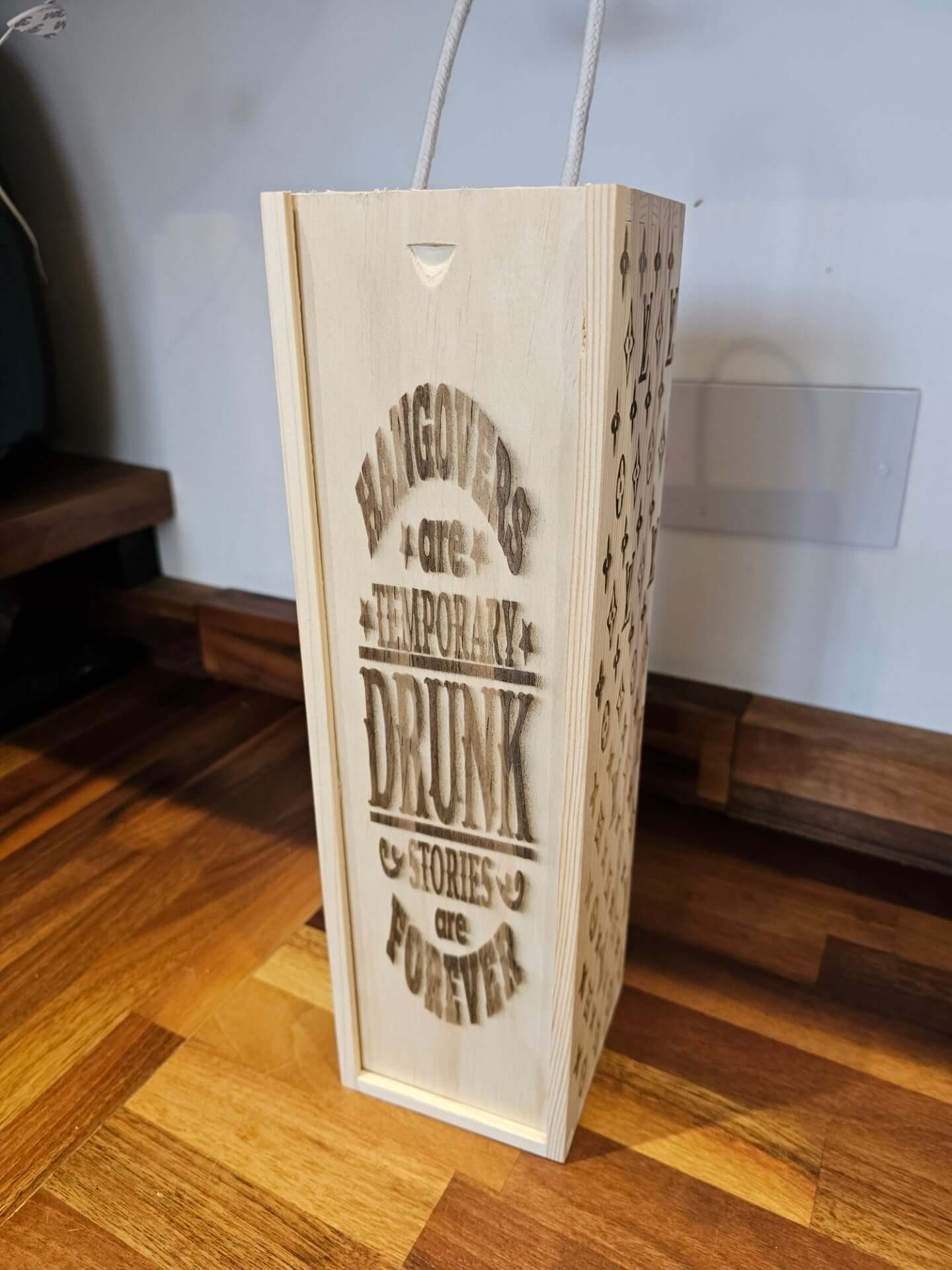 Engraved Wooden Wine Bottle Gift Box with a humorous quote about drunken stories.