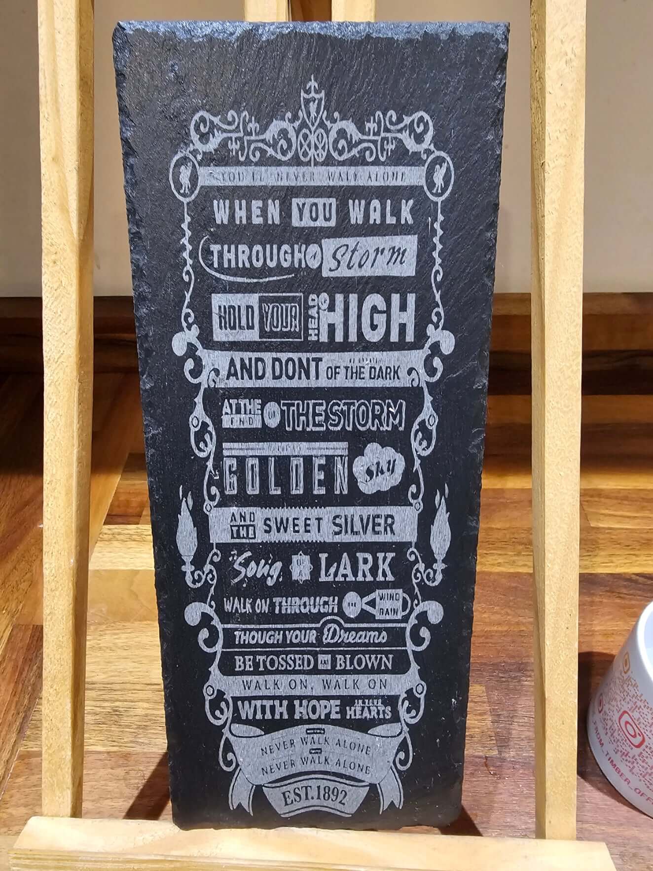 engraved slate plaque you'll never walk alone showcasing inspirational lyrics and designs