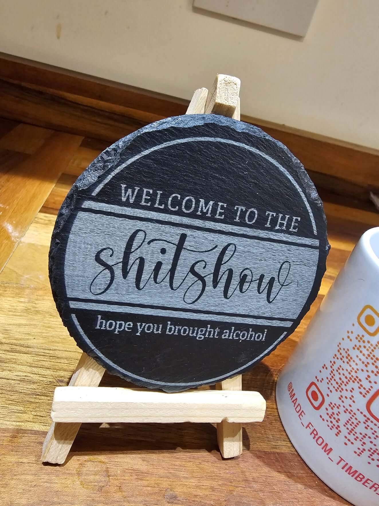 Slate Coasters Engraved featuring a humorous design that says 'WELCOME TO THE shitshow hope you brought alcohol'