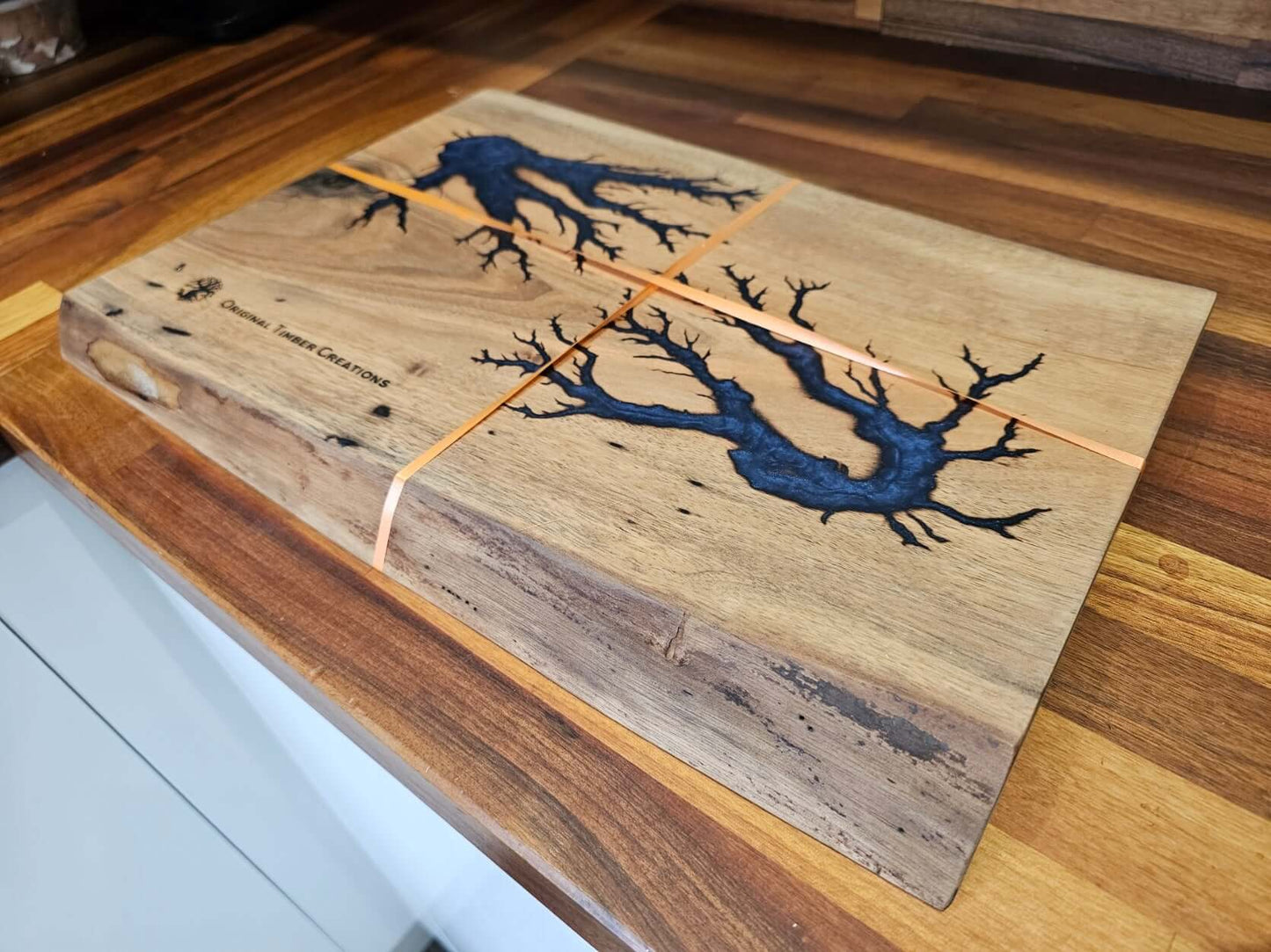 Handcrafted Resin Inlaid Wooden Board showcasing deep blue resin inlays on natural wood surface, 420 mm x 300 mm x 38 mm.