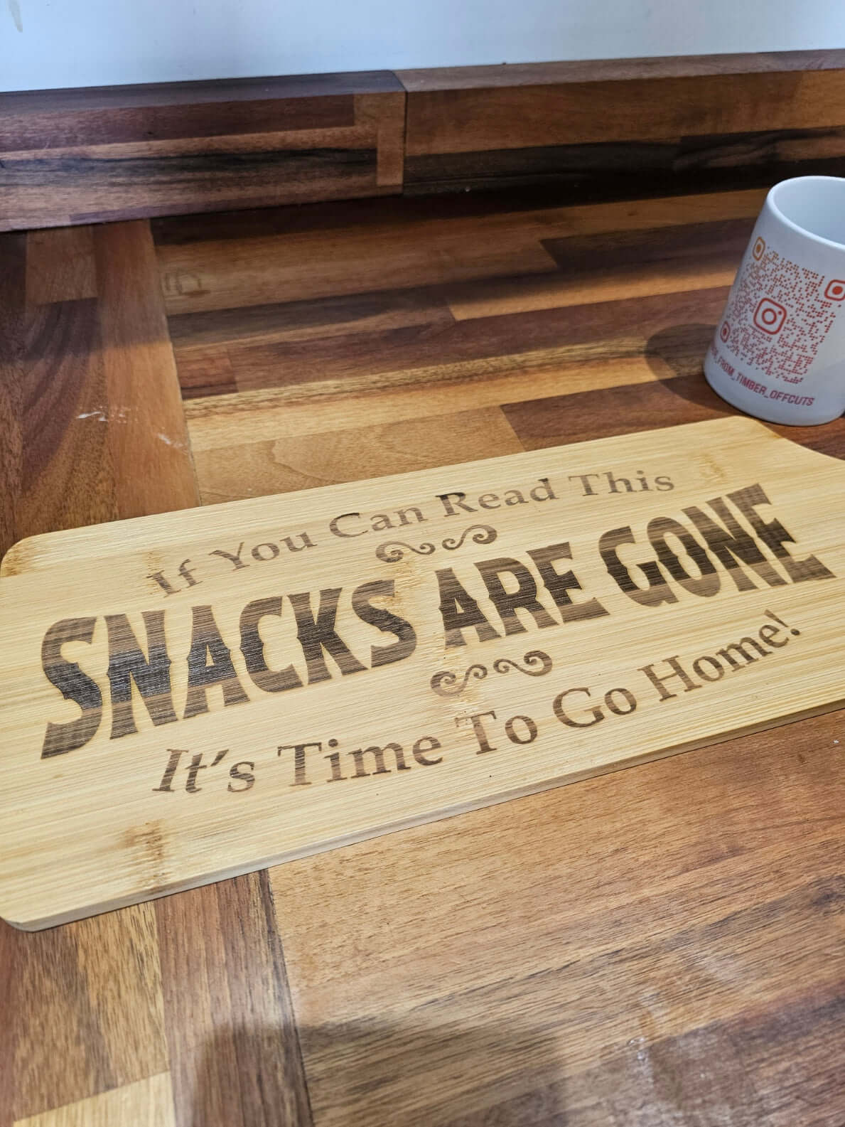 Funny Engraved Serving Board with the quote 'If You Can Read This SNACKS ARE GONE It's Time To Go Home' on bamboo.