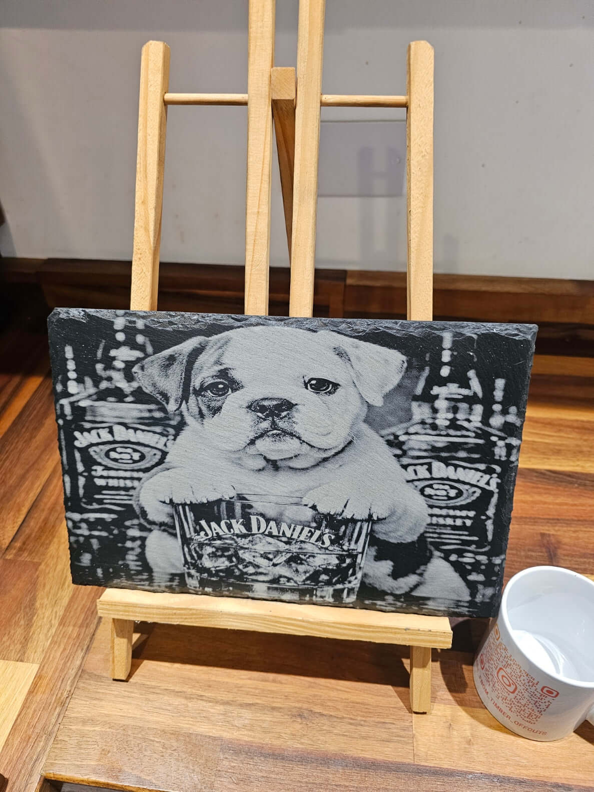 Funny Bulldog Jack Daniels Slate Plaque on display, showcasing a bulldog pup with a whiskey glass.
