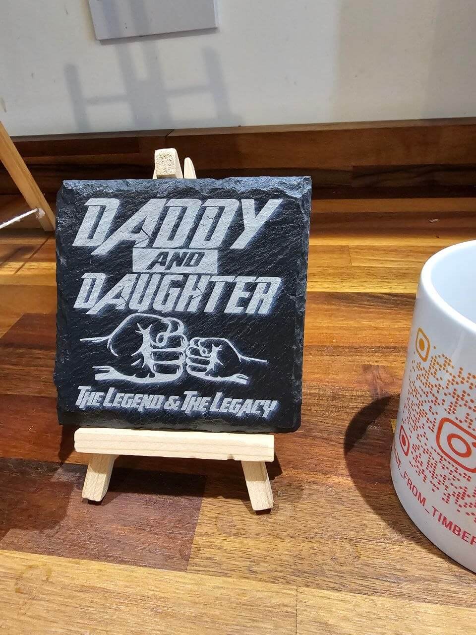 Slate Coasters Daddy & Daughter on display with fist bump design and engraved text, celebrating their bond.