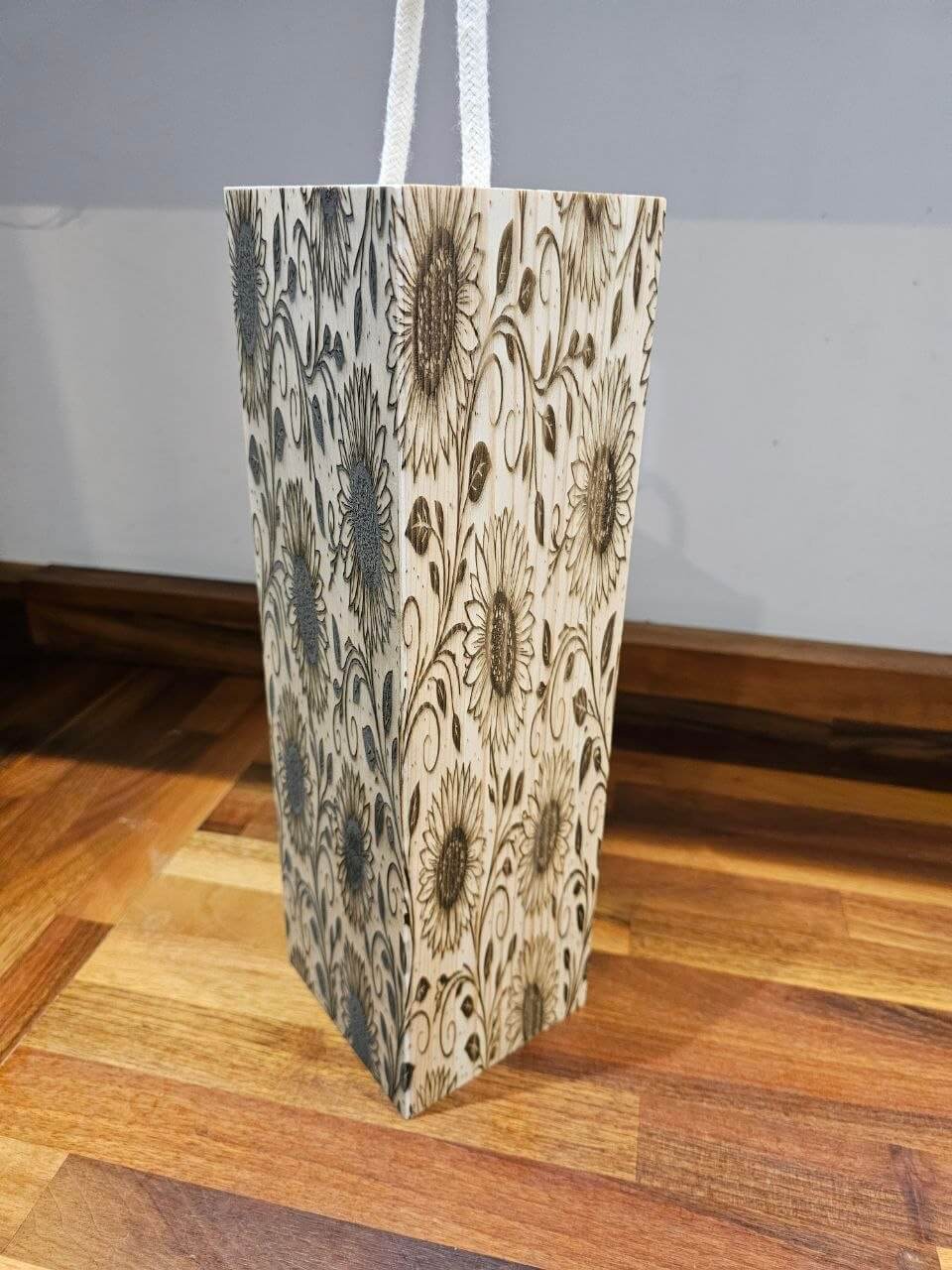 Engraved Wooden Wine Bottle Gift Box with floral design on display, showcasing craftsmanship and elegance.