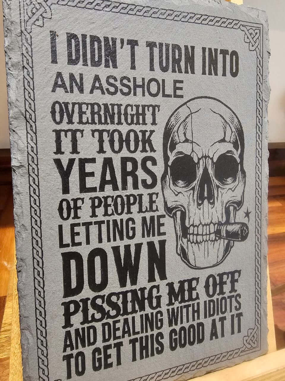 I Didn’t Turn Into an Asshole Overnight slate plaque. 30x20cm featuring a bold skull illustration and humorous quote.