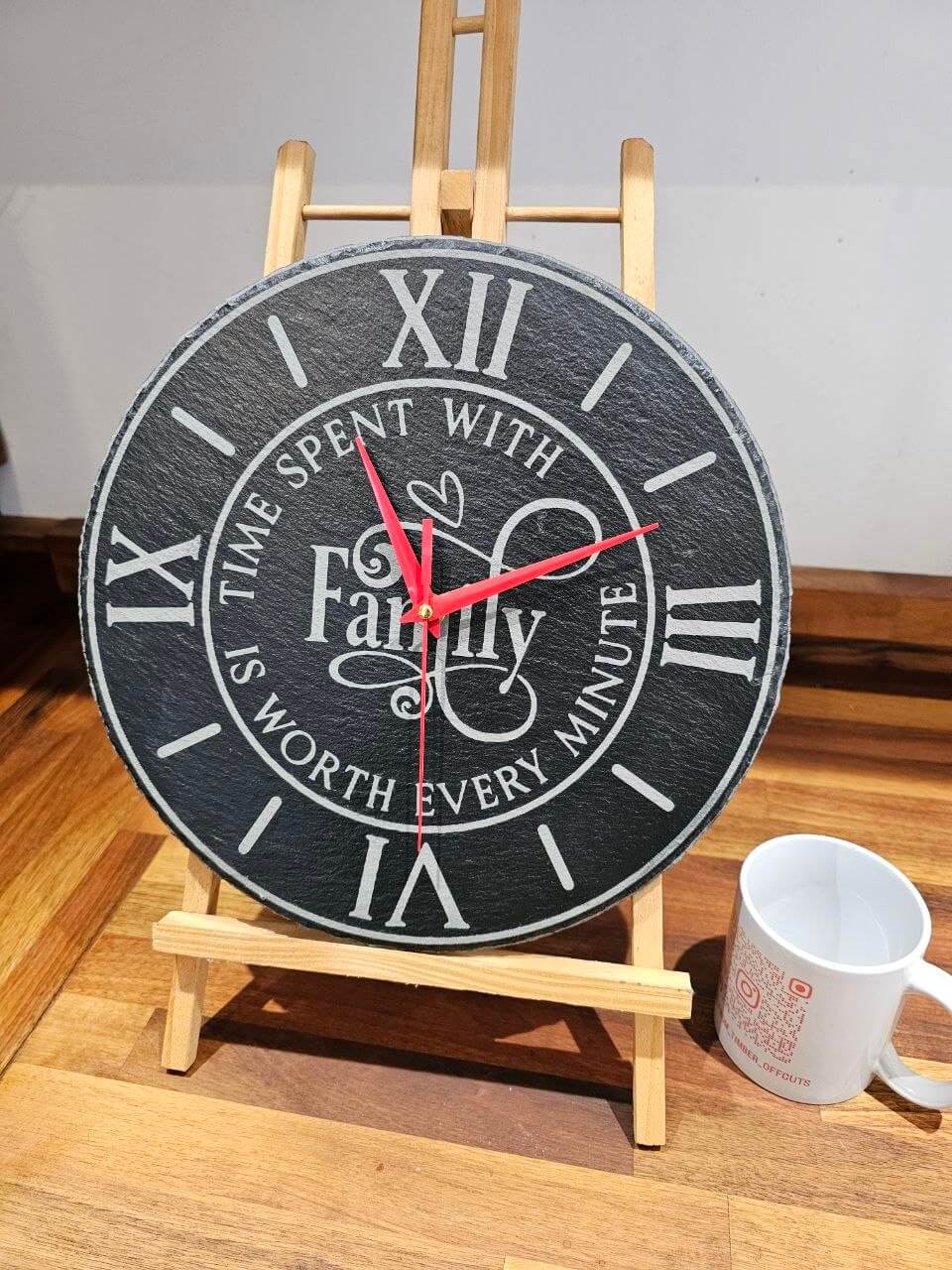 Family Time Engraved Round Slate Clock showcasing the quote 'Time Spent With Family Is Worth Every Minute'.