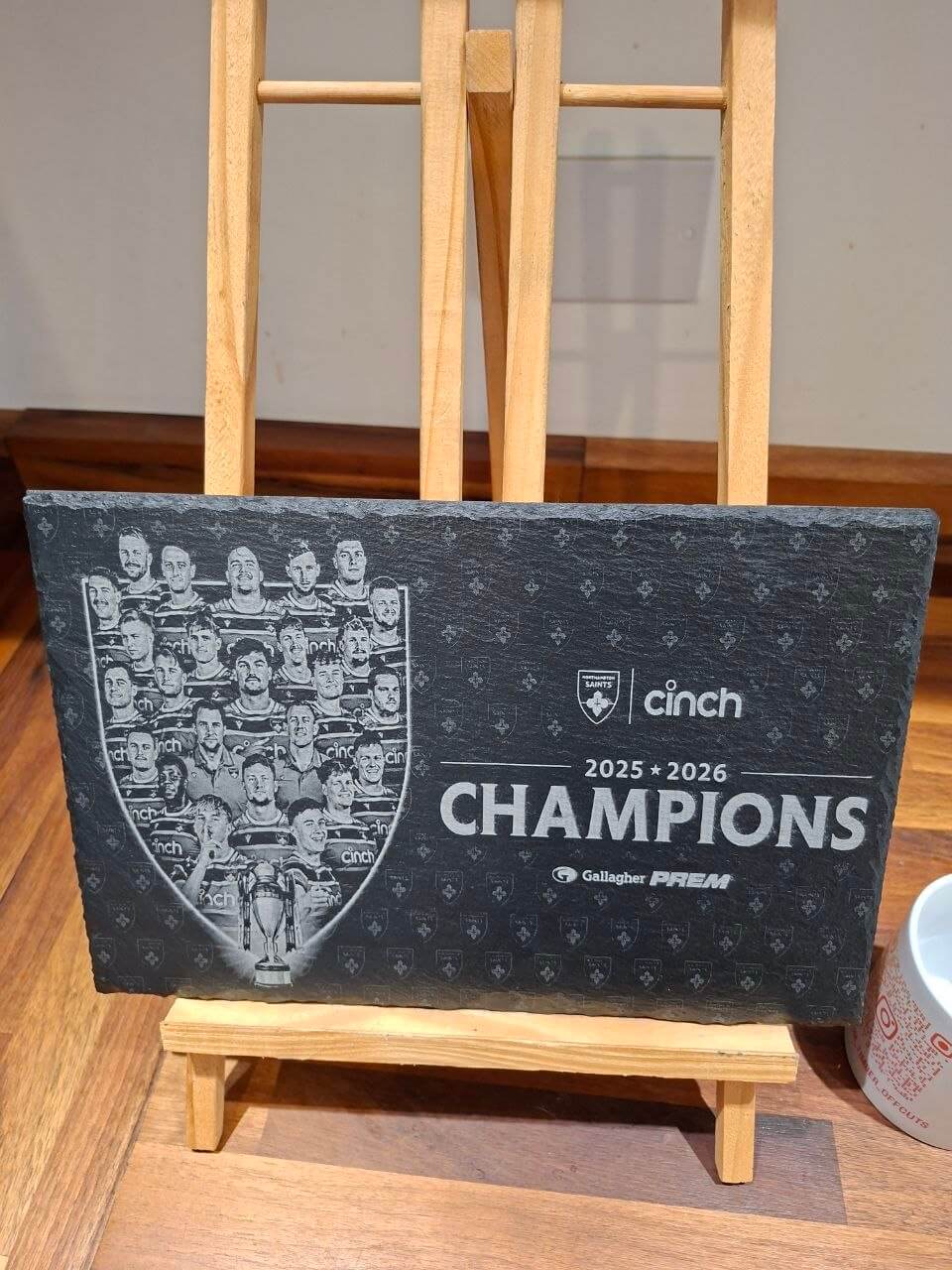 Northampton Saints Champions 2025 2026 Engraved Slate Plaque displayed on an easel, celebrating the championship season.